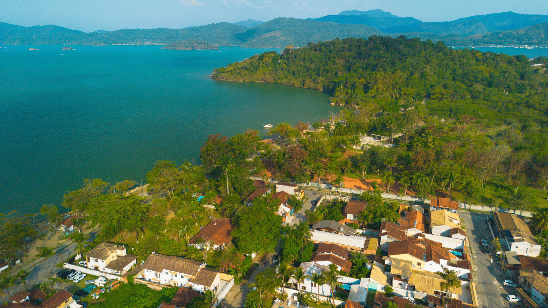 Aerial view of Paraty Bay with Pontal and Jabaquara beaches, green hills, and boats