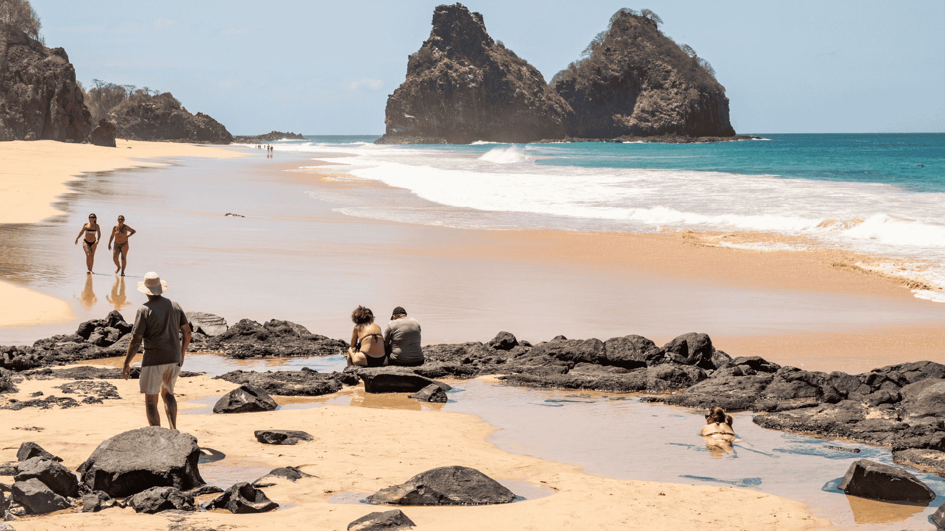 People on the beach in Fernando de Noronha_Oliveira Lawyers