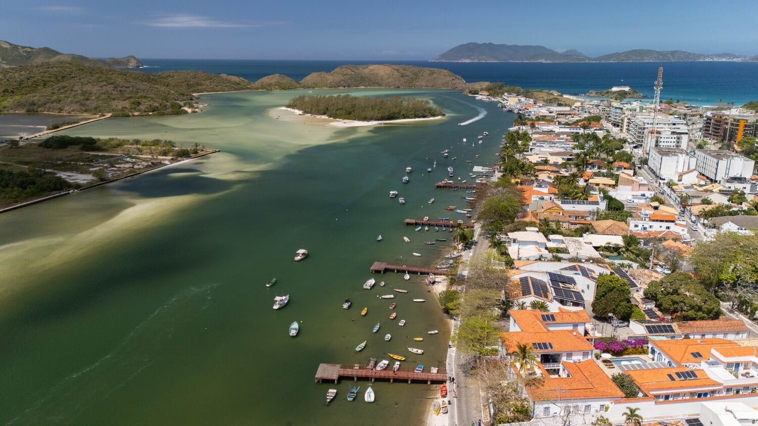 Cabo Frio canal scene with colorful boats moored along the waterfront