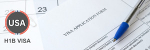 H1B visa application form with a pen, highlighting the importance of accurate documentation.