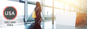 Professional woman with luggage at the airport, ready to travel with an EB2 NIW visa.