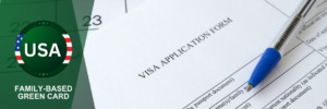 Application form with pen for visa processing, representing the family-based green card process.