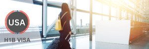 Professional woman at the airport, illustrating travel flexibility with an H1B visa.