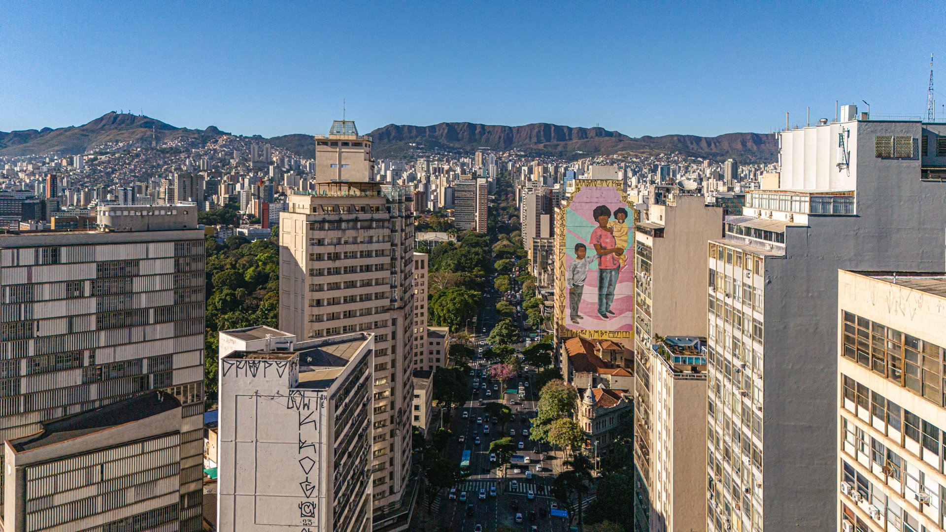 Aerial panorama of Belvedere district, Belo Horizonte, with modern high-rises and the distant Serra do Curral.