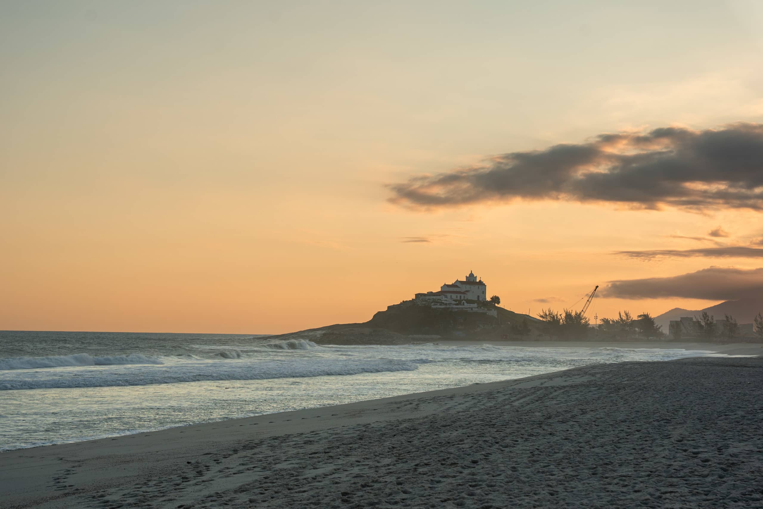 Soft dawn glow over the hilltop church of Nossa Senhora de Nazareth, Saquarema | Photo by: Flor Yanez