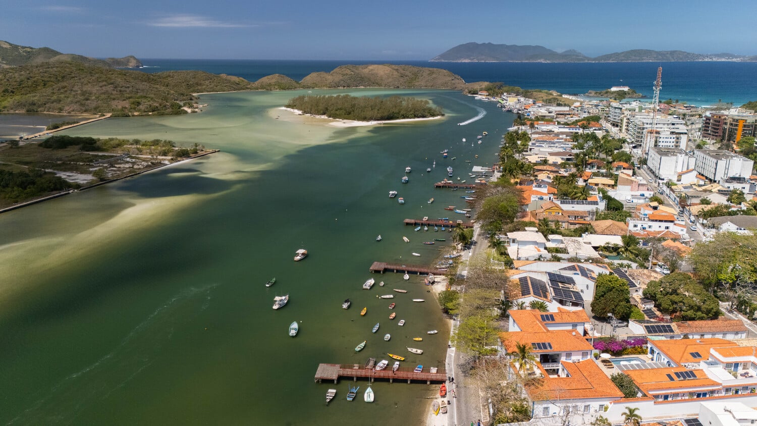 Cabo Frio canal scene with colorful boats moored along the waterfront