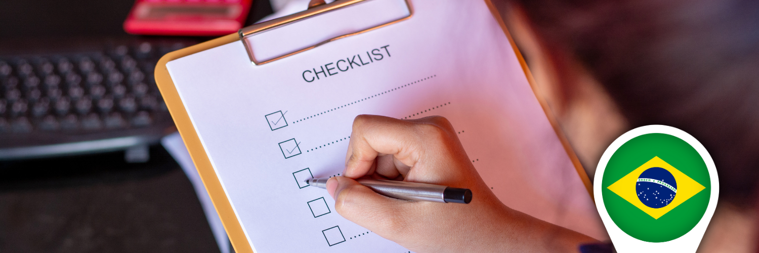 Hand ticking items on an off‑plan property buyer checklist for Brazil