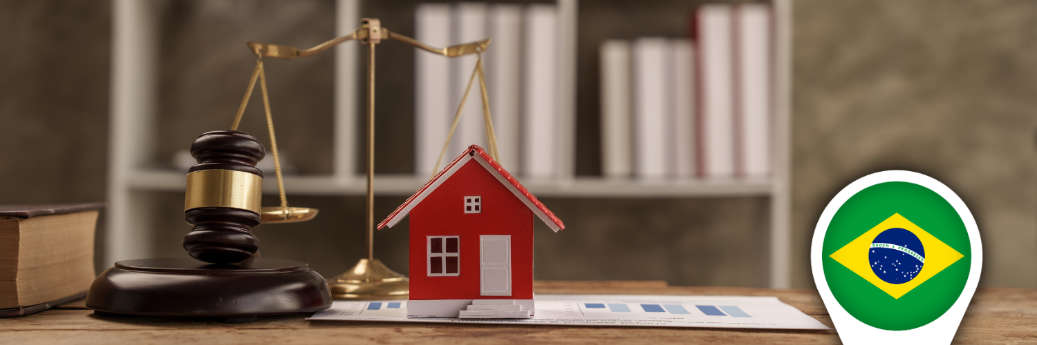 Model apartment building on top of legal documents and a gavel, symbolizing Brazilian real estate law for off‑plan projects