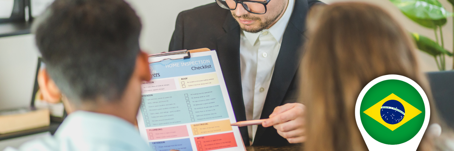 Real estate broker presenting an off‑plan Brazilian condo project to foreign buyers at a sales stand
